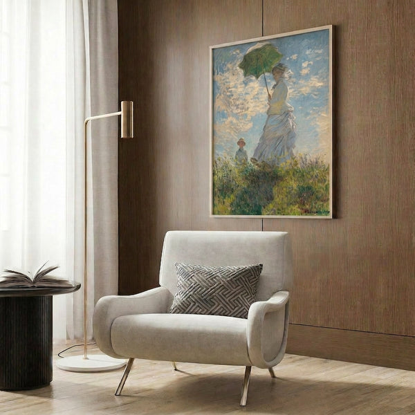 Impressionist wall print capturing a peaceful moment of a parasol-carrying woman and child in a sun-flooded meadow with gauzy, luminous brushstrokes.
