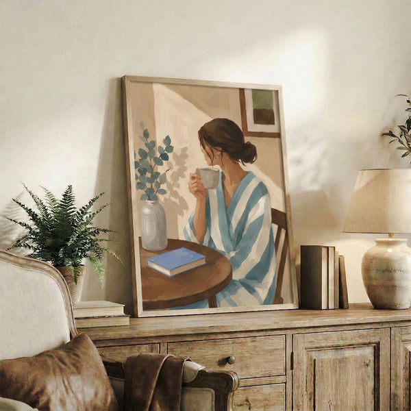 Watercolor framed poster of a thoughtful woman enjoying coffee near a sunlit window, surrounded by a plant and book in peacefully muted cream and teal shades.