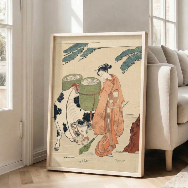 Traditional woodblock art of a kimono-wearing woman beside a placid cow, with terracotta accents and bamboo elements creating a peaceful, pastoral mood.