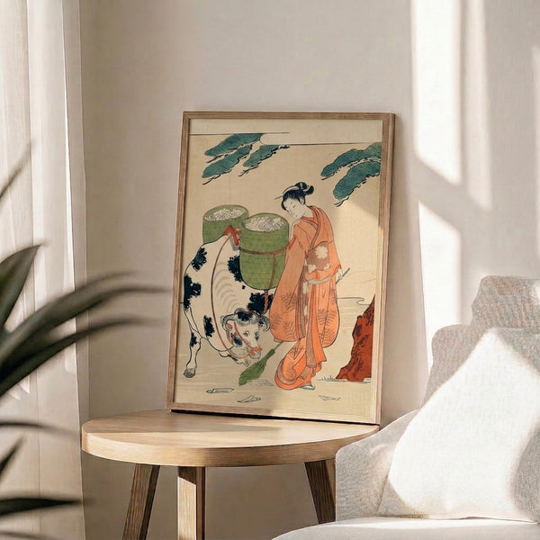 Japanese woodblock poster with a woman in patterned kimono and a cow in an intimate domestic setting, rendered in soft creams and pale blue-greens with bold black details.