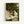 Claude Monet garden painting poster displayed on wall, capturing sunlit women among flowering plants with loose brushstrokes in a luminous palette of pastels and greens.
