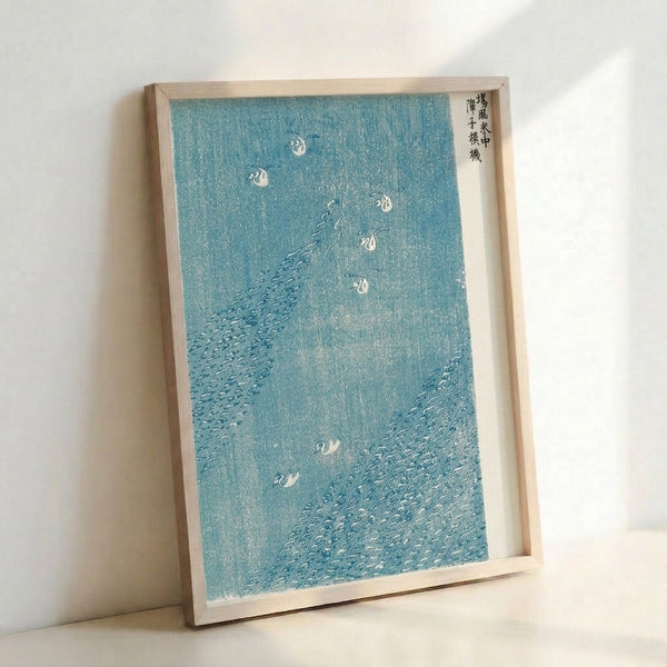Meditative Japanese woodblock artwork showing birds navigating turbulent waves and marsh grasses rendered in calming blue-gray and white palette.