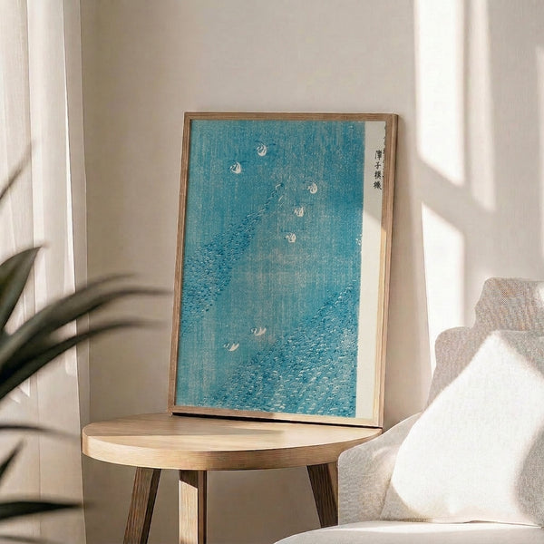 Peaceful ukiyo-e inspired wall art showing waterfowl sheltering among reeds during rainfall, executed in soft teal, gray, and cream pigments.