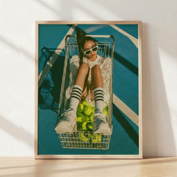 Y2K pop art poster featuring a stylish woman in sunglasses and colorful socks pushing a shopping cart filled with apples on a teal tennis court, rendered in lime green and cream tones.