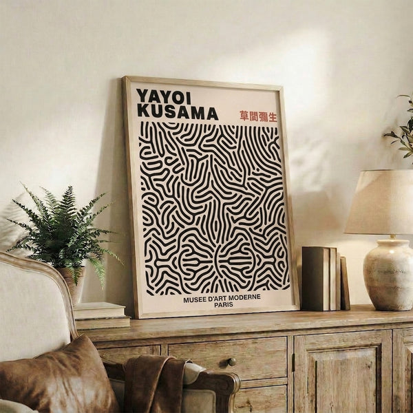 Cream-colored framed poster showcasing meditative abstract curves and organic line work in black and terracotta, museum-quality minimalist design.