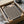 Contemporary museum-quality poster featuring serene abstract patterns of curved lines and organic motifs in cream, black, and earthy rust tones.