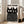 Modern poster of black cats rendered with haunting white dot overlays and striking gaze, capturing a whimsical yet bold artistic vision in black and cream tones.
