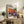 Vibrant contemporary poster featuring surreal pumpkins adorned with colorful polka dot patterns in blue, yellow, and purple against warm red and orange tones.