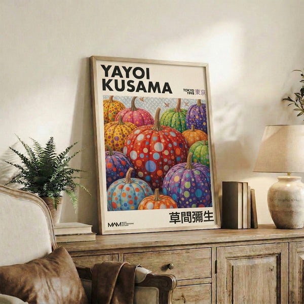 Vibrant contemporary poster featuring surreal pumpkins adorned with colorful polka dot patterns in blue, yellow, and purple against warm red and orange tones.
