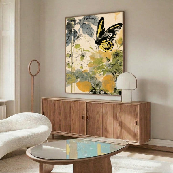 Tranquil botanical watercolor print of a graceful yellow swallowtail butterfly nestled among garden flowers and verdant vines in soft, natural color palette, framed on wall.