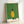 Serene Japandi wall art showing a resting dog dressed in a golden yellow raincoat and hat with coordinating bag, composed in elegant line work against soft sage and cream hues.