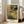 Wall art depicting delicate dancers in warm yellow and ochre tones with cream and pale blue, capturing the luminous quality of a stage moment.