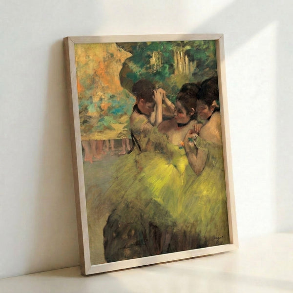 Classical ballet scene showing dancers in yellow attire from behind, executed in Degas' signature pastel technique with a serene, contemplative mood and soft vintage color palette.
