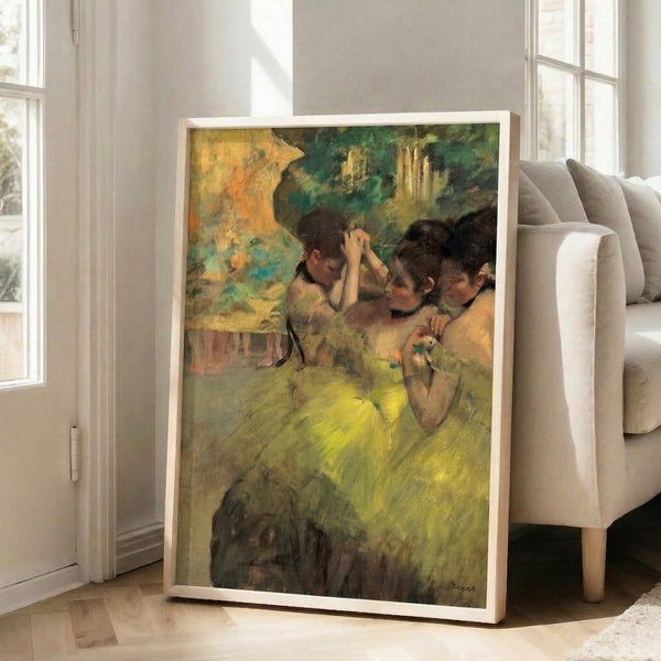 Framed art print of Degas' iconic composition featuring ballet dancers in butter-yellow gowns in an atmospheric backstage setting, blending cool blues and warm earth tones.