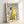 Yellow dog figure paired with flowing black hand lettering on white poster, modern quirky pet-themed wall art with folk art sensibility.