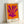 Framed wall art displaying organic yellow and pink cut-out shapes against white, evoking playful abstraction with a serene, contemporary aesthetic.