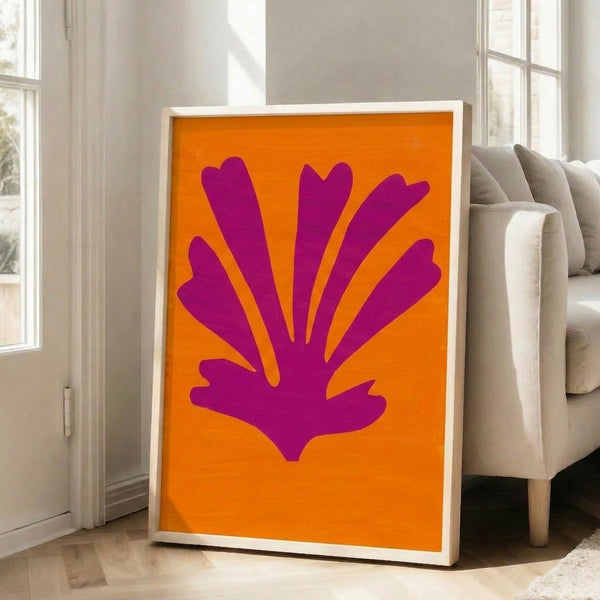 Framed print showcasing gentle pink and yellow organic forms in an abstract, cut-paper inspired artistic style.