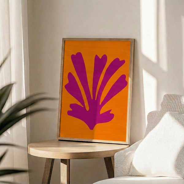 Muted yellow and blush pink abstract art print with flowing curved shapes, reflecting minimalist cut-out design principles.