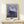 Dreamlike Impressionist composition of girls in a rowboat, blending Japanese woodblock influences with luminous blues and rose tones, presented as a framed poster.