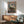 Wall art print in impressionist style showing figures in a small boat on water, peaceful scene with delicate color harmonies.