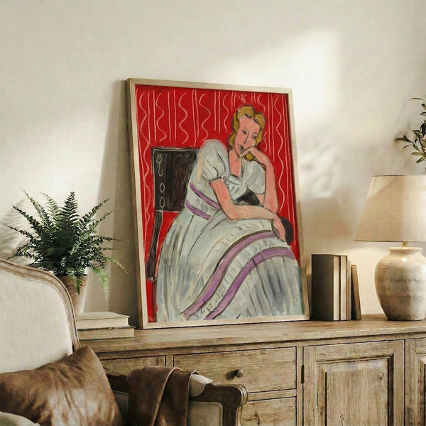 Framed watercolor art print depicting a contemplative young woman dressed in gray, rendered with soft washes and understated elegance.