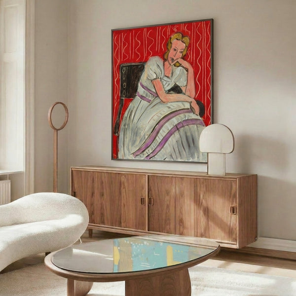 Soft watercolor painting of a young woman in gray seated pose, framed wall art showing refined minimalism and serene mood through muted earth tones.