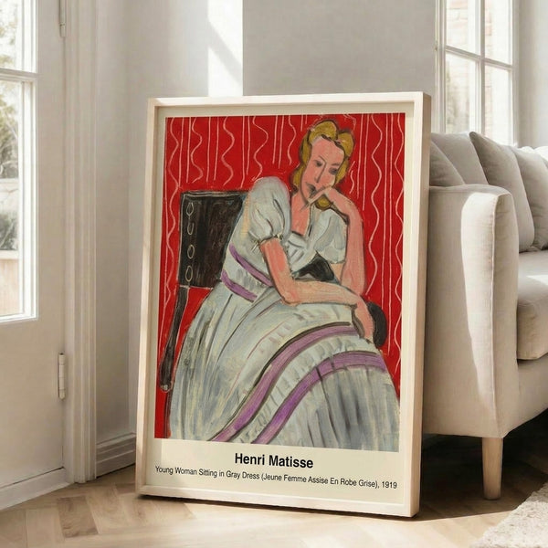 Modernist portrait print showing a contemplative young woman in a gray dress with refined violet and cream tones, displayed as framed wall art with an elaborate patterned background.