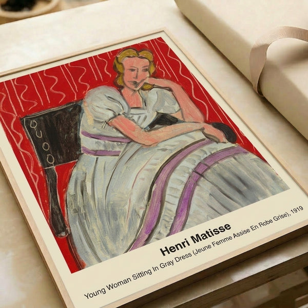 Impressionist watercolor portrait of a woman in gray dress displayed as framed wall art, her contemplative mood enhanced by the multi-colored ornamental wallpaper surrounding her figure.