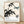 Minimalist Japanese ink wash painting of a dragonfly perched on delicate bamboo leaves, rendered in black and teal blue on cream background, creating a serene and meditative aesthetic.