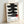 Serene wall art poster with stacked kanji symbols rendered in expressive black ink and red highlights on a neutral cream ground, embodying meditative Japanese minimalism.