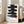 Minimalist poster art showcasing bold black ink brushstrokes with red accents arranged in a meditative stack, inspired by Zen and Japanese woodblock traditions.