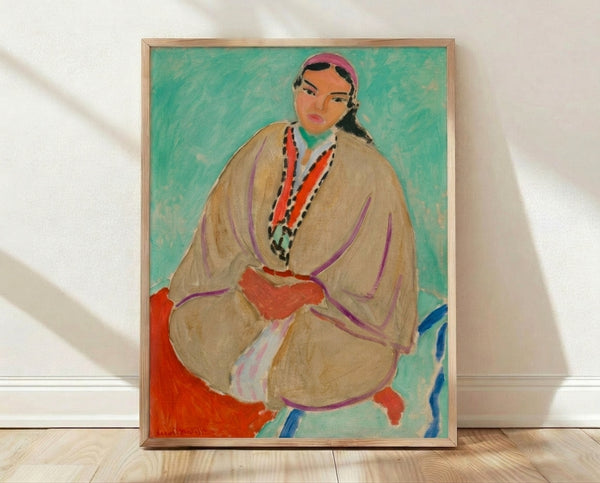 Matisse portrait of a woman in profile with bold yellow background and expressive brushstrokes, framed on wall.