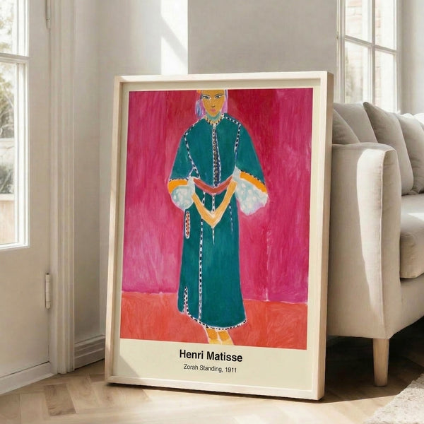 Wall-mounted art print of an elegant standing figure rendered in ochre, deep blue, and cream with simplified forms characteristic of modern Art Nouveau design.